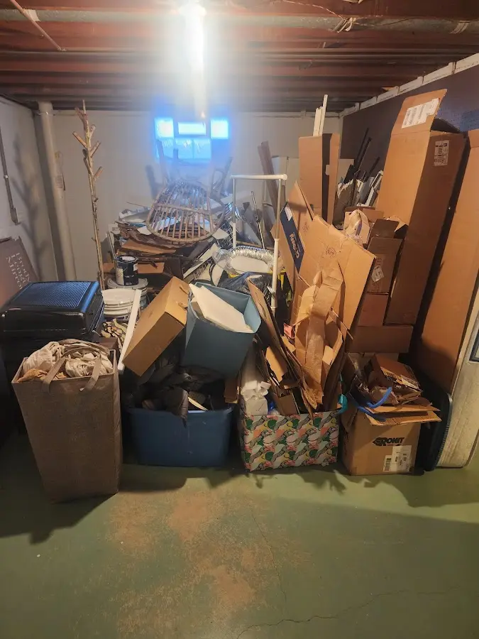 Roll-off dumpster container at job site for 2 Yard Dumpster Rental in Grand Rapids